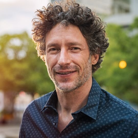 Headshot of person smiling